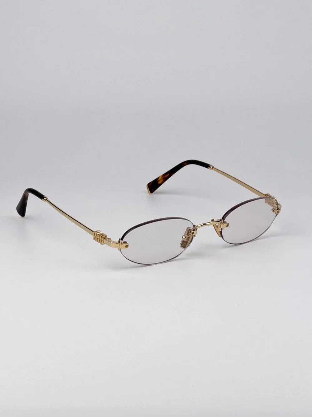 Miu Miu Women’s Eyeglasses – MUA54S 5AK08N | Gold Oval Rimless